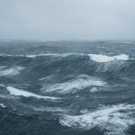 Rough ocean waves under a cloudy sky
