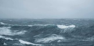 Rough ocean waves under a cloudy sky