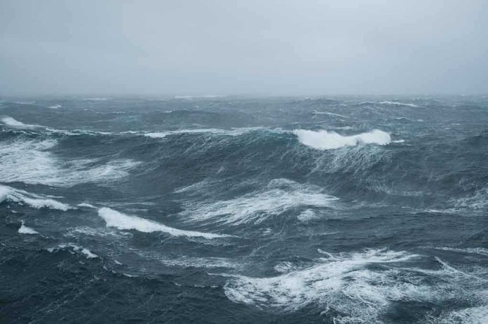shutterstock_65406475.jpg Rough ocean waves under a cloudy sky