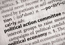 Close-up of a dictionary entry for political action committee