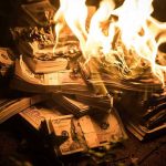 Rubio TORCHES $100 Million in State Department Spending Stacks of hundred dollar bills burning in flames.