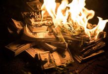 Rubio TORCHES $100 Million in State Department Spending Stacks of hundred dollar bills burning in flames.