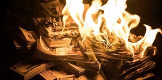 Rubio TORCHES $100 Million in State Department Spending Stacks of hundred dollar bills burning in flames.