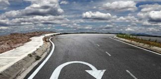 Trump’s Shocking Abortion Policy Reversal Curved road with a U-turn arrow marking.