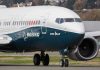 Boeing 737 MAX airplane on runway.