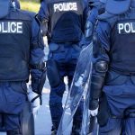 Young Girl’s Nightmare – Heinous Crime Police officers in riot gear with shields.