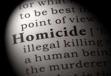 Magnified text showing definition of homicide.