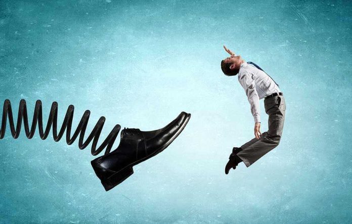 353283212 Man gets kicked by oversized shoe on spring.