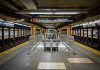 Miraculous Survival – Subway Baby Shocks NYC Subway station platform with directional signs overhead.