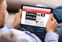 Unbelievable Twist in Former First Lady Saga Person reading tablet with headline Scandal Unfolds.