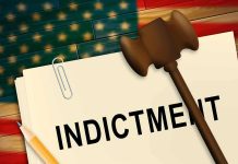 A legal document labeled INDICTMENT with a gavel and pencil