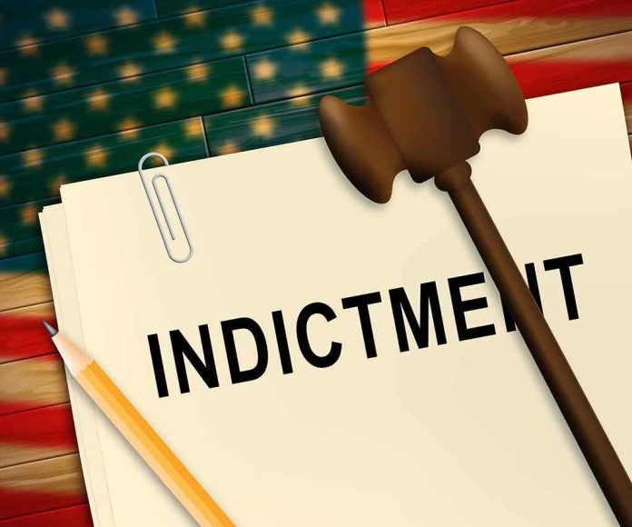 shutterstock_1435944215 (2).jpg A legal document labeled INDICTMENT with a gavel and pencil