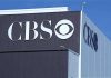 CBS Execs Demand Apology — Producer Refuses, Resigns! Exterior view of a CBS media building featuring the CBS logo