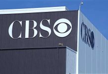 CBS Execs Demand Apology — Producer Refuses, Resigns! Exterior view of a CBS media building featuring the CBS logo