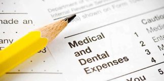 SHOCKING $6.5 Billion Medical Debt WIPED OUT Close-up of tax document with medical and dental expenses section and a yellow pencil
