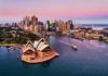Sydney Opera House and city skyline at sunset.