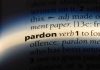 MAGA Heroes Freed — Massive Legal Shake-Up The word pardon highlighted in a dictionary.
