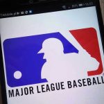 MLB Gambling Scandal EXPLODES—Feds Target Pitchers Major League Baseball logo on a smartphone screen.