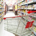 Consumer Rage Explodes: 74% Americans Furious Empty shopping cart in grocery store aisle.