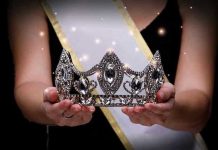 Miss Universe Owner VANISHES Before Fraud Verdict Sash-wearing person holding an ornate jeweled crown.