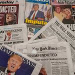 Newspaper headlines about Trumps indictment.