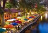 Wannabe Influencer STEALS Restaurant Meals—Judge FREES Her Outdoor riverside restaurant with colorful umbrellas and evening lights.