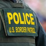 Unmarked Vehicles in Raids: Is It Abduction Or Not? Police U.S. Border Patrol uniform close-up.