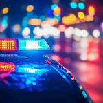 Police Chase Disaster—Night Turns Deadly Police car with flashing lights at night.