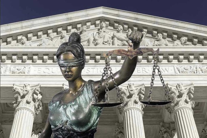 560959042 Lady Justice statue in front of courthouse.