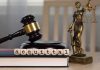 Border Stop Blunder — Stunning Acquittal A gavel and the word acquittal spelled with letter blocks on a desk