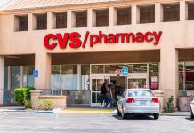 Exterior view of a CVS pharmacy with customers entering