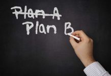 Top Democrat Slams Socialist Shift A hand writing Plan B on a chalkboard with Plan A crossed out