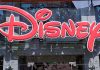 MASSIVE Disney Meltdown Rocks Wall Street Bright red Disney logo displayed on a storefront window