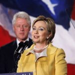 Clintons Subpoenaed: Epstein Secrets Unveiled? Hillary Clinton delivering a speech with Bill Clinton in the background