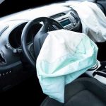 Deployed airbags in cars interior.