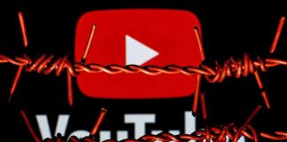 YouTube logo behind barbed wire lines.