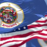 MASSIVE COVID Fraud Scheme Rocks America Minnesota state flag with American flag in background.