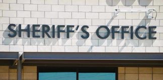 Custody Exchange Turns Into BLOODBATH Sheriffs Office sign on brick building faade.