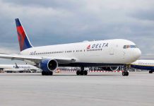 SHOCKING Airline Cover-Up Leaves Passengers Bleeding Delta Airlines airplane on airport runway, cloudy sky.