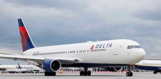 SHOCKING Airline Cover-Up Leaves Passengers Bleeding Delta Airlines airplane on airport runway, cloudy sky.