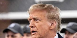 MASSIVE Foreign Policy Shake-Up Nobody Saw Coming Man in suit and red tie speaking outside.