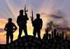 ISIS Terrorists Timed Execution for Mother’s Birthday Three armed silhouettes near a smoky city skyline.