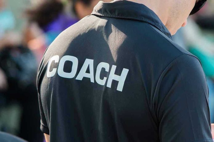 Person wearing a shirt labeled Coach.