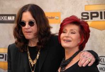 SHOCKING Encounter Stops Sharon Osbourne’s Suicide Plan A celebrity couple posing together at a red carpet event, smiling and dressed in stylish outfits