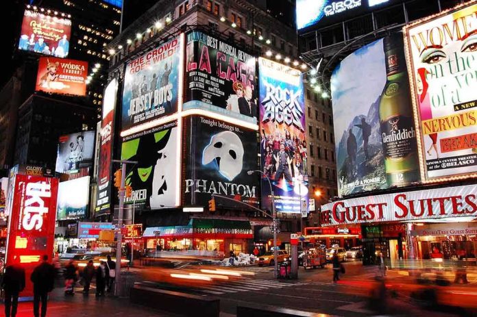 shutterstock_1029004501.jpg Vibrant night scene of Times Square filled with theater advertisements and neon lights