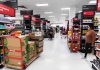Black Friday Horror: Worker Trampled to Death Interior of a grocery store with shelves filled with products and shoppers