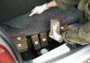 Narco-Terrorists Running Drugs To America ELIMINATED Person discovering wrapped packages in a car trunk.
