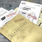 New Epstein Files Dump: Bill Gates Named Classified documents with Top Secret stamps on wooden surface.