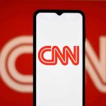 BRUTAL Takedown Leaves CNN Panel Stunned CNN logo on a phone screen.