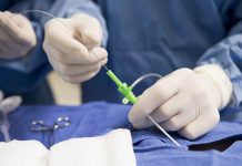 Cosmetic Surgery Skyrockets Among Men—Why Now? Medical professional preparing an intravenous catheter in a sterile setting